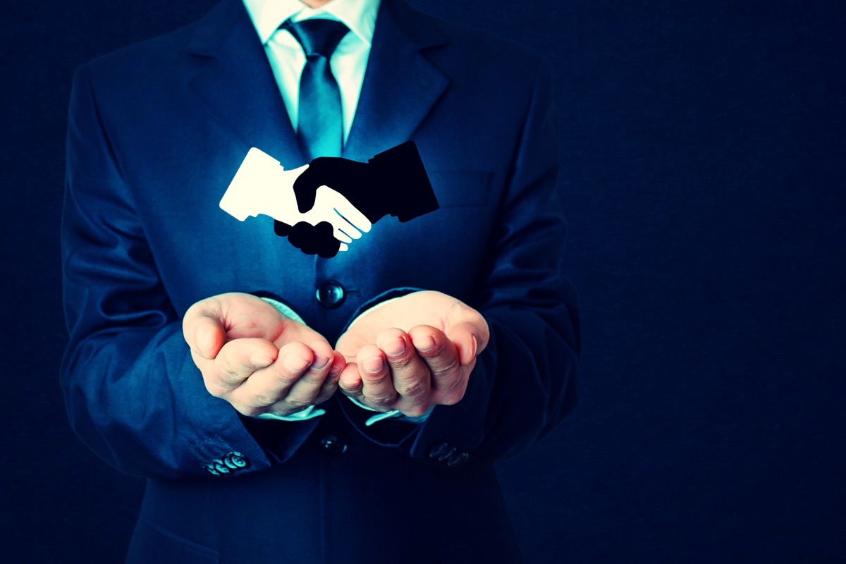 freepik-business-handshake-symbol-on-dark-blue-background