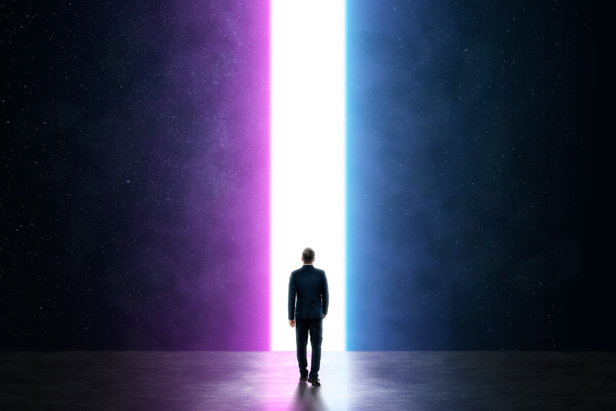freepik-silhouette-of-a-man-in-a-business-suit-in-front-of-a-glowing-neon-portal