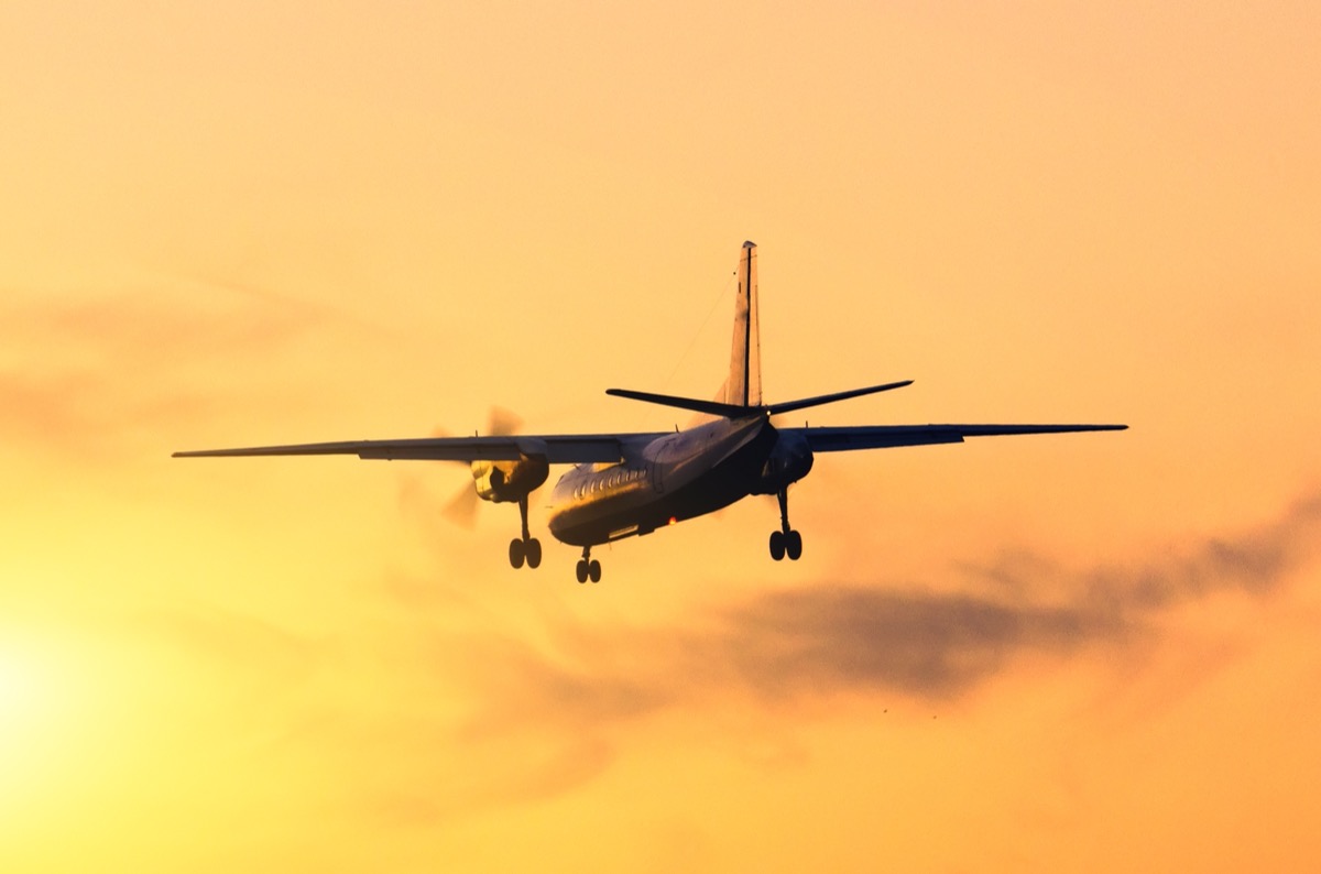 freepik-airplane-landing-against