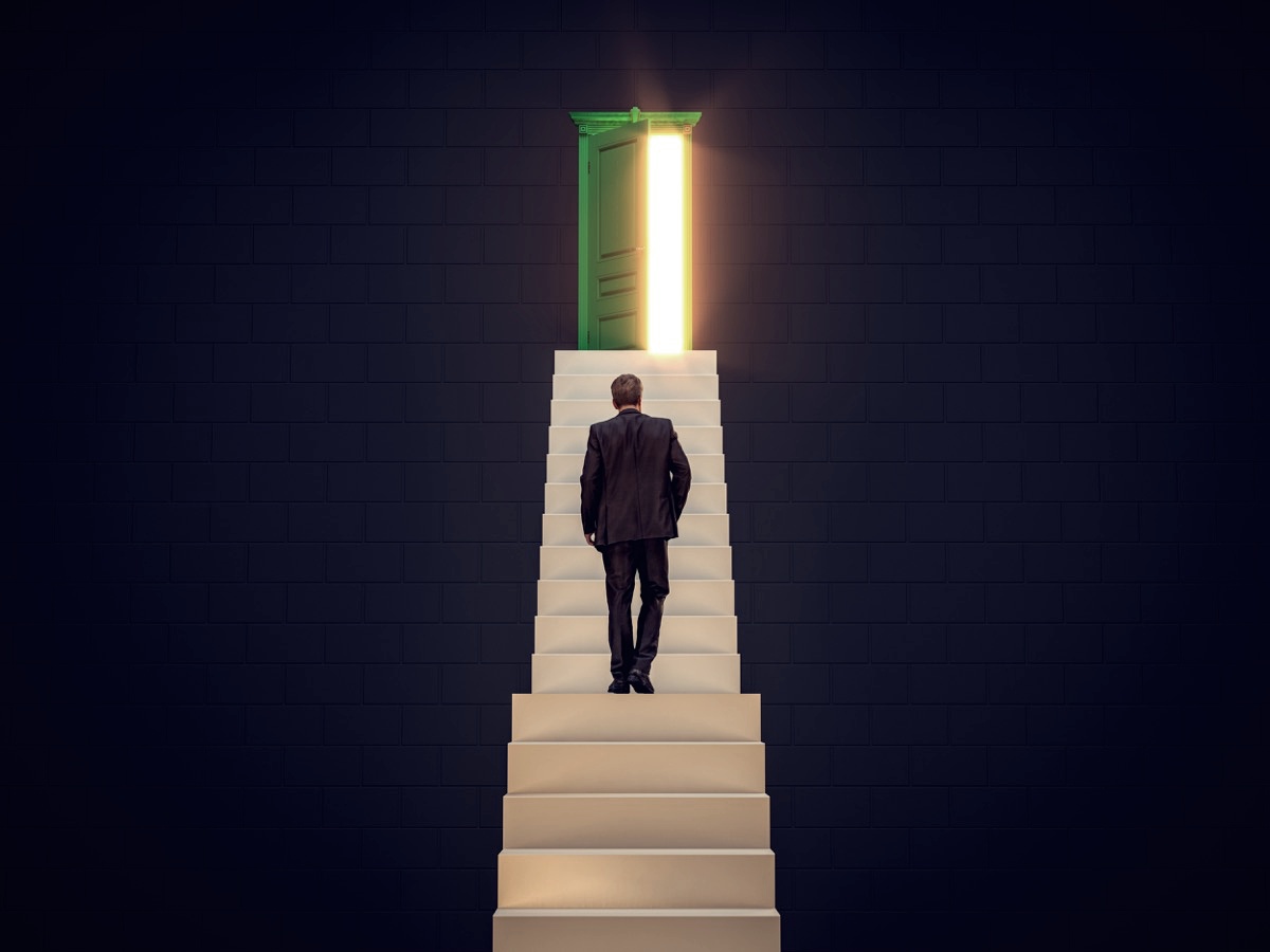 freepik-businessman-walking-up-on