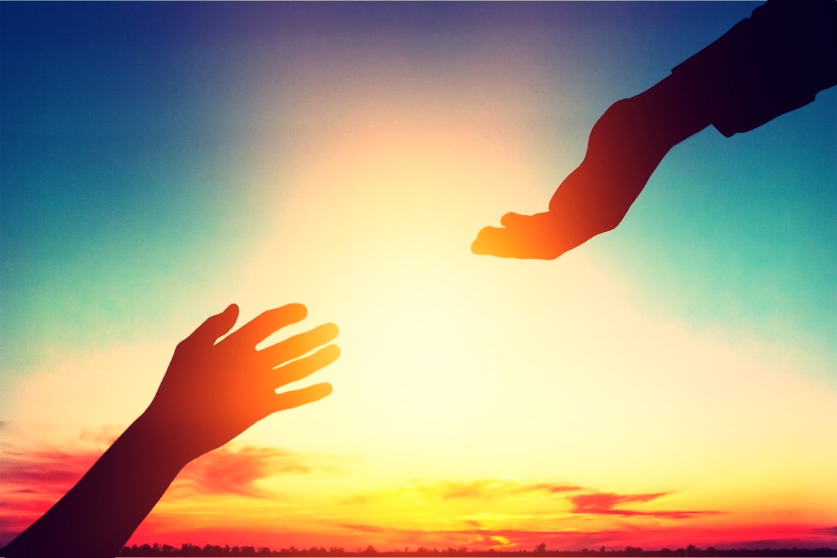 freepik-help-hand-on-sunset