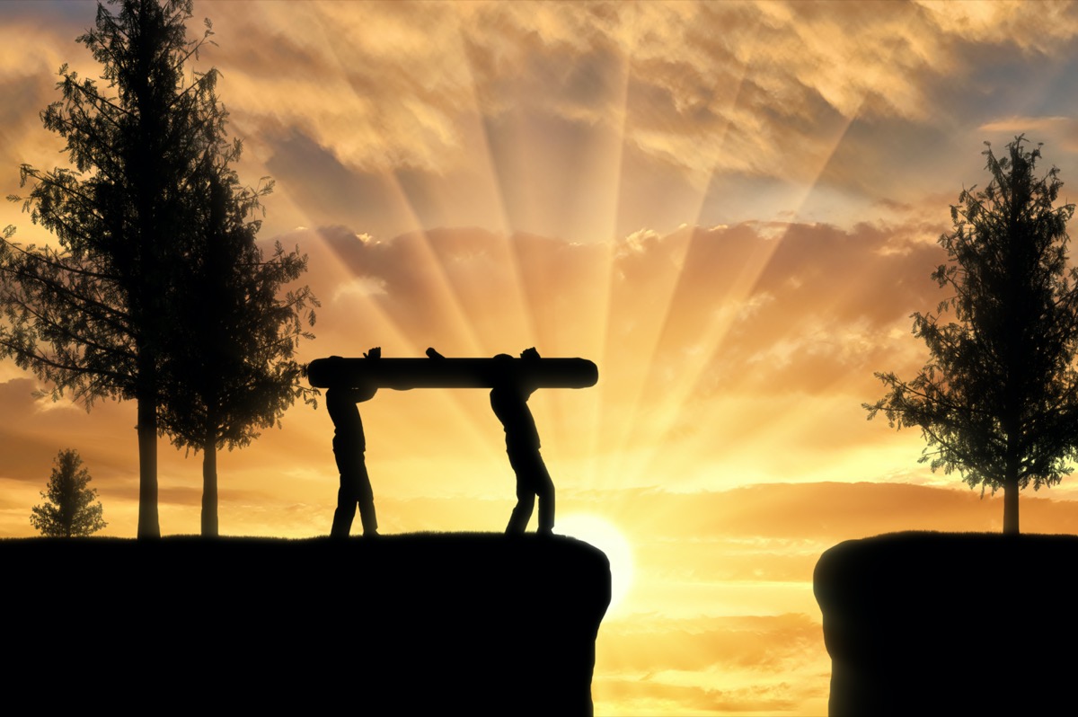 freepik-silhouette-two-men-carry